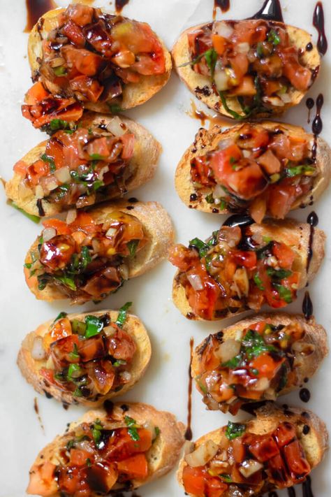 This is the best bruschetta recipe ever. Whenever I make homemade bruschetta, it reminds me of Italy. I love Italian appetizers, and this easy bruschetta is no stranger. I love making this simple bruschetta for an easy appetizer when I am entertaining! #gayglobetrotter #bruschetta #easybruschetta #tomatobruschetta #italianbruschetta #homemadebruschetta #crostini #tomatoes Crostini With Tomatoes, Soulfood Appetizers, Brushetta Appetizers, Best Bruschetta Recipe, Bruchetta Appetizers, Best Bruschetta, Bruschetta Recept, Bruschetta Recipes, Easy Bruschetta Recipe