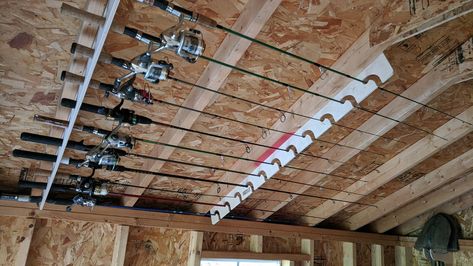 Ceiling Fishing Rod Storage, Garage Fishing Rod Storage, Fishing Rod Holders For Garage, Fishing Pole Storage Diy, Fishing Rod Storage Diy, Hunting Storage Room, Hunting Storage Ideas, Hunting Room Storage, Fishing Organization Ideas