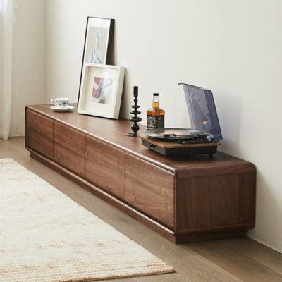 This TV stand is crafted from high-quality black walnut wood, known for its hardness, clear grain, and resistance to deformation and cracking, ensuring a long lifespan. It features four large-capacity drawers to meet daily storage needs and keep your living room tidy. The spacious top surface is perfect for placing a TV, speakers, or books. The enclosed bottom design offers superior weight-bearing capacity, ensuring stability and durability without wobbling. | Aurora Craft Black Walnut TV Stand Tv Stand Walnut, Tv Drawer Design, Tv Stand Shelf Decor, Media Console Living Room, Walnut Furniture Living Room, Walnut Tv Cabinet, Credenza Wood, Walnut Tv Stand, Tv Stand Brown