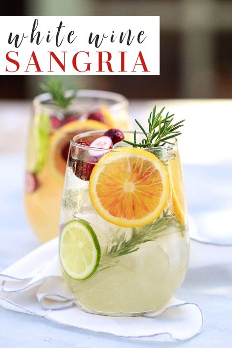 white sangria recipe: The best easy white wine sangria with orange (for winter) or peach (for summer). This winter sangria is perfect for Christmas and such a delicious Spanish cocktail recipe! #wine #sangria #cocktails Dry White Wine Sangria, Fall White Sangria Recipe, Homemade Sangria White Wine, White Wine Sangria Recipe Fall, Winter White Sangria Recipe, White Winter Sangria Recipes, Fall White Wine Sangria, Easy Wine Cocktails, White Sangria Recipe Easy Summer