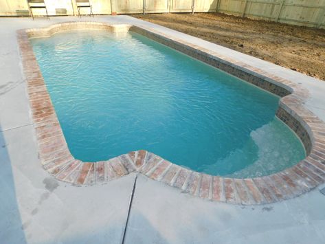 Beautiful Roman shape, brick coping, sandstone color Pool Tile With Brick Coping, Pool Copping, Pools With Brick Coping, Pool With Red Brick, Brick Coping Around Pool, Pools With Red Brick Coping, Brick Pavers Around Pool, Brick Pool Surround, Roman Shaped Inground Pool