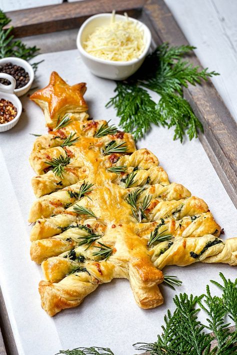 It's the festive season and this Spinach Puff Pastry Christmas Tree is savory treat you, your family, and guests will love. Simple to make with a cheesy spinach filling, store-bought puff pastry and pizza sauce for serving. Christmas Tree Puff Pastry Spinach, Spinach Puff Pastry Christmas Tree, Cheesy Spinach Dip Christmas Tree, Savoury Xmas Party Food, Christmas Tree Appetizers Food Ideas, Christmas Tree Croissant, Christmas Table Food Ideas, Puff Pastry Xmas Tree, Savoury Christmas Treats