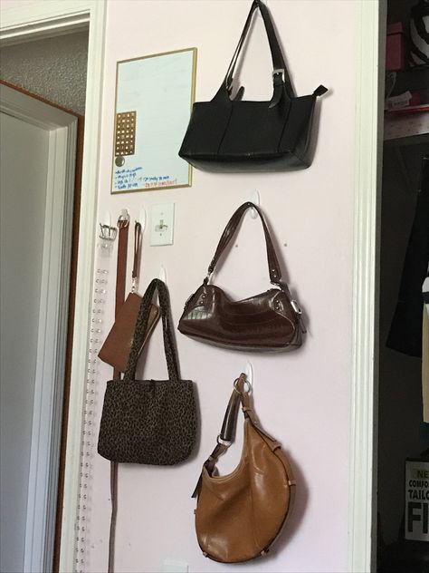 Purse Wall Aesthetic, Hang Bags In Room, Ways To Hang Purses On Wall, Hanging Handbags On Wall, Purses Hanging On Wall, Purse On Wall, Purse Wall Display Bedroom, Hanging Purses On Wall, Purse Organization Wall