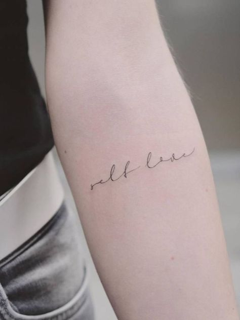 a beautiful cursive written tattoo, 'self love', on arm Fine Line Quotes, Women Minimalist Tattoo, Tattoos For Women Minimalist, Best Small Tattoos For Women, Edm Tattoo, Wing Tattoos On Wrist, Patience Tattoo, Self Love Tattoos, Enough Tattoo