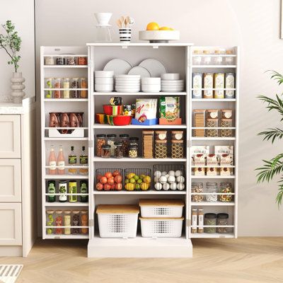 Well-organized and minimalistic,this storage cabinet delivers functional simplicity with elegance. Clean, modern lines with muted tones give a sense of warmth and harmony, with lots of communication between cooking and dining areas | Winston Porter Lailah 47.24" Kitchen Pantry White 47.24 x 23.62 x 15.75 in, Wood | C100187602 | Wayfair Canada Pantry White, Pantry Cabinets, Door Shelves, Pantry Cabinet, Dining Areas, Muted Tones, Kitchen Pantry, Clean Modern, Kitchen Storage Organization