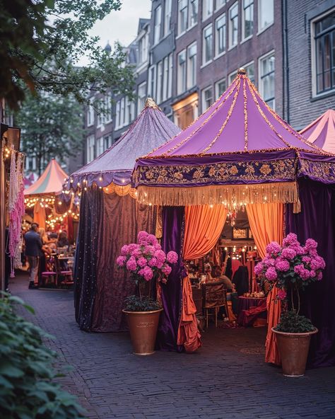 Currently taking place in Amsterdam is the festival Sleepover City, where residents invite each other to stay overnight in their homes or in tents in their front gardens. The entire city is decorated in purple, pink, and orange to indicate which houses offer a sleeping spot. In this festive spirit, residents move from tent to tent to visit each other, enjoy delicious food made by locals, and toast together. AI-generated, retouched and enhanced in post-production by @noellevandijk. — Part of ... Market Tent, Festival Tent, Amsterdam Architecture, Pink Tent, Tent City, Urban Intervention, Front Gardens, Potager Garden, Stay Overnight