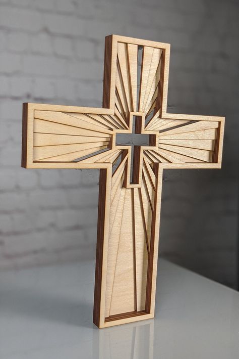 DESCRIPTION ✓ Handmade Religious Decor ✓ Christian Cross ✓ Wall Or Free Standing A true religious piece of art, minimalist wooden cross, available in 3 size choices. Handmade, planned, designed and laser cut from Baltic birch wood in multiple layers, then stuck together creating a must-have decoration for every Christian household. Cut out from 6 different layers from the highest quality wood, left unpainted but treated with natural eco-friendly bee wax. However, on request, I can add a color or Small Wooden Crosses Handmade, Wood Crosses Ideas, Wooden Clock Plans, Wood Crosses Diy, Wood Wall Cross, Cross Wall Art, Stuck Together, Bee Wax, Crucifixion Of Jesus