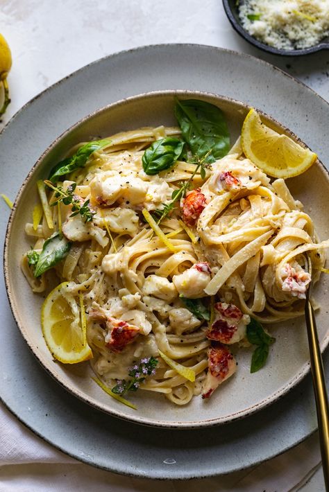 Creamy Lemon Pasta with Lobster is the ultimate date-night-in meal. It starts by poaching lobster tails in white wine & thyme, and ends with a simple, creamy lemon infused sauce. For a creamy pasta dish, it's rich, as to be expected, but still light enough in flavor to be perfect for summer! Especially with a crisp glass of white wine or rosé! #lobster #pasta #lemon #datenight #dinner Pasta With Lobster, Pasta With Lemon Sauce, Pasta Lemon, Creamy Lemon Pasta, Seafood Lobster, Cabo Trip, Fettuccine Recipes, Lobster Pasta, Meal Calendar