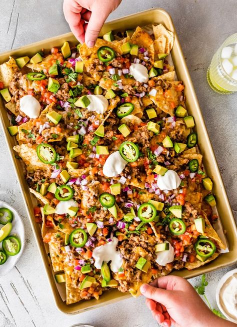 Make the best loaded nachos with this easy recipe. Tortilla chips are topped with a ground turkey refried bean mixture, cheese, tomatoes, avocado and jalapeños for the perfect appetizer or game day snack! Recipe Tortilla, Nachos Cheese Recipe, Refried Bean, Jalapeno Cheese, Loaded Nachos, Nachos Recipe, Game Day Snacks, Perfect Appetizers, Party Food Appetizers