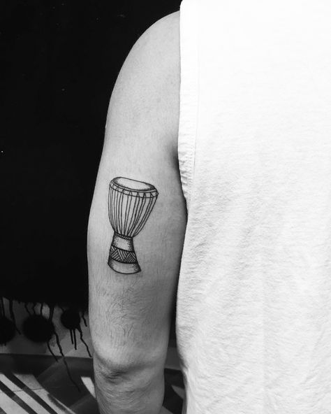 African drum djembe tattoo by @karmarianna #karmarianna #linework African Drum Tattoo, Gambia Tattoo, Djembe Tattoo, Minimalist Tatoos, Tattoo Queen, Drum Tattoo, Djembe Drum, African Drum, Red Ink Tattoos