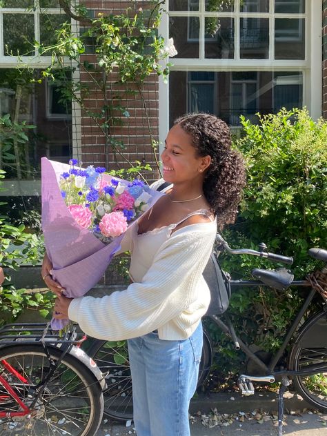 Mixed girl holding a beautiful bouquet of flowers with pink, blue and white flowers, wearing a cute summer outfit, smiling, curly hair Happy Girl Aesthetic Black Women, Soft Girl Lifestyle Aesthetic Black Women, Soft Girl Black Women, Girls Girl Aesthetic, Girl Happy Aesthetic, Being A Girl Aesthetic, Black Soft Girl Aesthetic, Kind Girl Aesthetic, Soft Girl Aesthetic Black Women