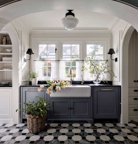 Behind The Modern Restoration Of A Dutch Colonial In Seattle | Luxe Interiors + Design Modern Dutch Colonial, Dutch Colonial Homes Interior, Kitchen Sink Wall, Colonial Home Interior, Parisian Kitchen, Dutch Colonial Homes, Black Kitchen Island, Black Dining Room, Dutch Colonial