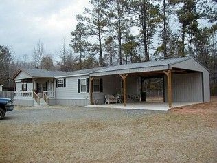 Rustic Manufactured Home Interiors, Modular Homes Exterior Makeover, Doublewide Mobile Home With Garage, Mobile Homes With Carports, Mobile Home Build On, Double Wide Carport Ideas, Trailer Remodel Single Wide Mobile Home Makeovers Exterior, Single Wide Trailer Remodel Exterior, Double Wide With Garage