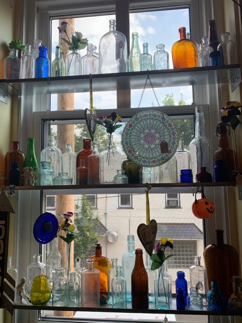 Bottles In Window, Old Glass Bottles Ideas Display, Glass Bottles In Window, Glass Bottle Aesthetic, Glass Bottle Collection, Glass Bottle Aesthetic Decor, Glass Bottle Collection Display, Antique Stores Aesthetic, Antique Store Aesthetic