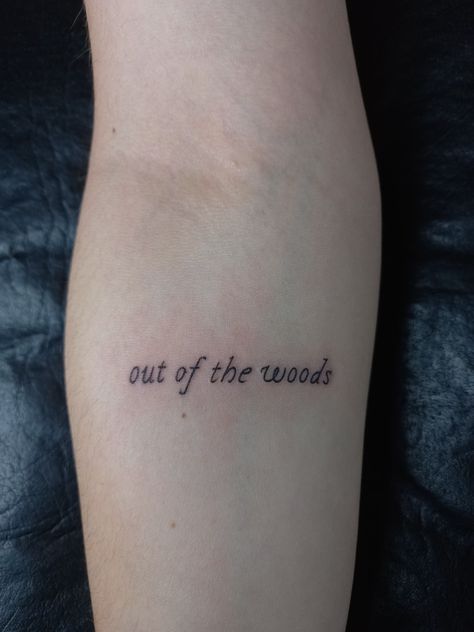 Taylor swift inspired tiny tattoo Taylor Swift Tattoo Out Of The Woods, Out Of The Woods Taylor Swift Tattoo, Into The Woods Tattoo, Out Of The Woods Tattoo Taylor Swift, Wood Tattoo Ideas, Out Of The Woods Tattoo, Taylor Swift Lyrics Tattoo, Taylor Swift Lyric Tattoo, Taylor Swift Tattoo Ideas Lyrics