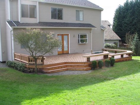 Trex deck and benches in Kirkland Deck With Partial Railing, Deck Off Back Of House Farmhouse, Back Deck Decor Ideas, Deck Ideas New Zealand, Ground Level Deck Ideas, Back Deck Decor, Patio Deck Decorating Ideas, Deck Ideas Backyard, Floating Deck Ideas