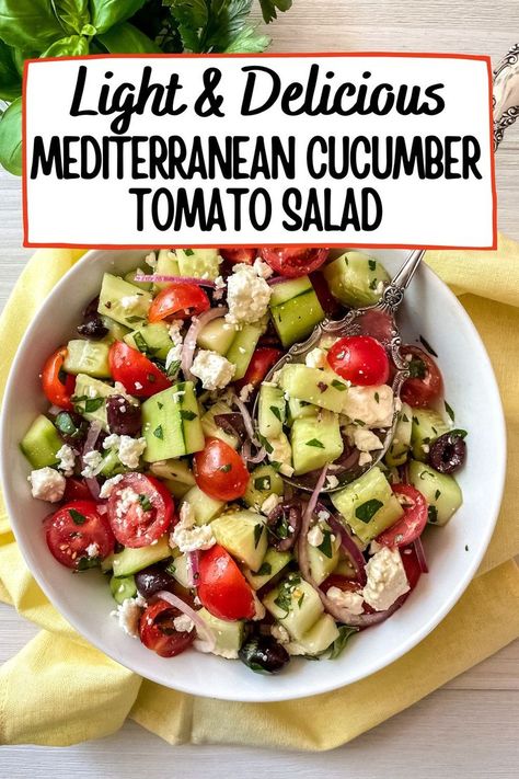 Cucumber tomato salad in a white bowl with a silver spoon, on top of a yellow napkin. Cucumber Grape Tomato Salad, Tomato Cucumber Feta Salad Balsamic, Cherry Tomatoes Cucumber Salad, Marinated Cucumbers Onions And Tomatoes All Recipes, Cherry Tomatoes And Cucumber Salad, Healthy Summer Salad Recipes Dinners, Cava Tomato And Cucumber Salad, Cucumber Salad With Tomatoes, Cucumber Tomato Onion Feta Salad