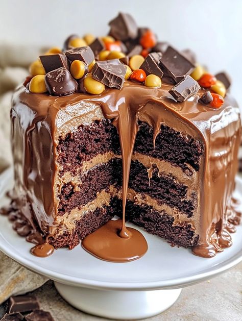 Reese's Peanut Butter & Chocolate Cake Sensation

🍰 𝗜𝗻𝗴𝗿𝗲𝗱𝗶𝗲𝗻𝘁𝘀 🍰 
1 box chocolate cake mix
1 cup water
1/2 cup vegetable oil
3 large eggs
1/2 cup creamy peanut butter
1/4 cup powdered sugar
1 container (16 oz) chocolate frosting
1 cup mini peanut butter cups, chopped
1/2 cup chocolate chips 🍰🍰 Reeces Cake Birthday Easy, Reese Birthday Cake, Reese’s Cake, Reeses Peanut Butter Cake, Reese Cake, Reeces Cake, Reese Peanut Butter Cake, Reese's Cake, Peanut Butter Chocolate Cake