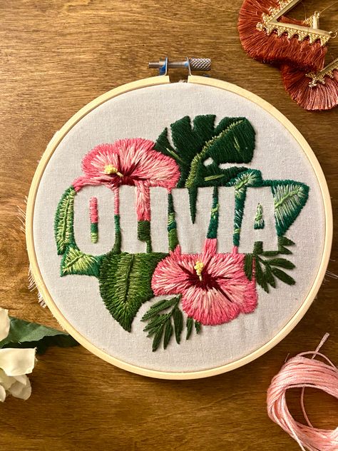 Olivia name negative space embroidery with tropical flowers Negative Space Embroidery Pattern, Tropical Flowers Embroidery, Negative Space Embroidery Letters, Tropical Embroidery Design, Negative Embroidery, Name Embroidery Ideas Letters, Olivia Embroidery, Name Embroidery Ideas, Embroidery Name Designs