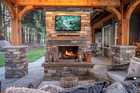 Outdoor Wood Burning Fireplace | HGTV Stained Wood Beams, Outdoor Stone Fireplaces, Outdoor Wood Burning Fireplace, Fireplace Pictures, Rustic Landscape, Outdoor Fireplace Designs, Outdoor Fireplace Patio, Outdoor Gas Fireplace, Outdoor Remodel