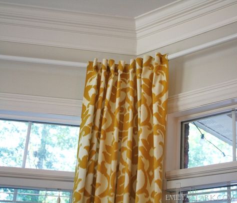 emilyaclark.com How to hang curtains in a bay window!  IKEA to the rescue! Angled Windows, Bay Window Treatments, Corner Curtains, Bay Window Curtain Rod, Bay Window Curtain, Bay Window Curtains, Hang Curtains, Curtain Hanging, Yellow Curtains