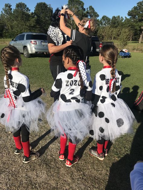 Dalmatian team costume. Simple tutu, white shirt with felt spots, black leggings, eyeliner to draw face spots and simple chocker. #softballlife #halloweencostumes #halloweentournament #8u #softball Team Halloween Costumes Soccer, Softball Costumes For Tournament, Zombie Softball Player Costume, Softball Team Costume Ideas Sports, Team Halloween Costumes Softball, Softball Halloween Team Costumes, Softball Team Costume Ideas, Halloween Soccer Tournament Costumes, Halloween Softball Tournament Costumes