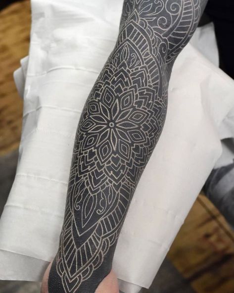 50 Blackout Tattoos With White Ink For Perfect Contrast | 50 Blackout Tattoos With White Ink Check Out The Emerging Trend Of White Ink Tattoos On Blackout Sleeves. Lifestyle Black Leg Sleeve Tattoo, Black Out Mandala Tattoo, Blacked Out Tattoo With White Ink, Blackout White Ink Tattoo, White Over Blackout Tattoo, Blacked Out Sleeve Tattoo, Blackout Half Sleeve Tattoo, White On Black Tattoos, Black Filler Tattoo