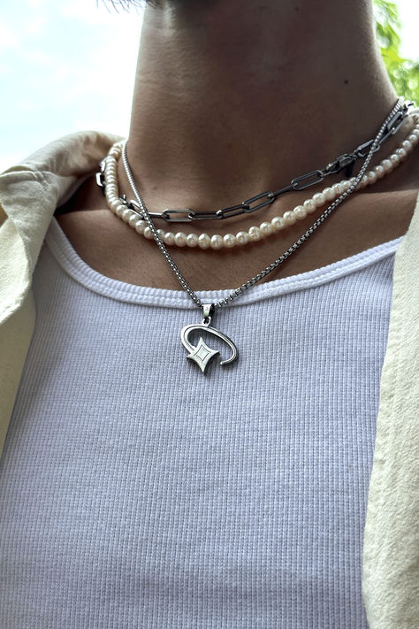 Picture of a silver shooting star pendant necklace for men. A unique cosmic jewelry piece made from stainless steel designed for streetwear fashion. It highlights a man's sense of style and individuality, perfect for a modern man who wants to stand out in urban fashion. #shootingstar #streetwear #stainlesssteeljewelry #menaccessory #modernjewelry Unique Streetwear, Streetwear Jewelry, Mens Silver Jewelry, Star Box, Silver Chain For Men, Boys Jewelry, Guys Clothing Styles, Mens Silver Necklace, Star Pendant Necklace