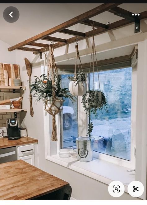 Bohemian Bay Window, Ladder Shelf Hanging, Macrame Window Shelf, Plant Shelf In Kitchen, Large Kitchen Window Ideas, Cabincore Kitchen, Boho Rv Decor, Hanging Ladder From Ceiling, Bay Window With Plants