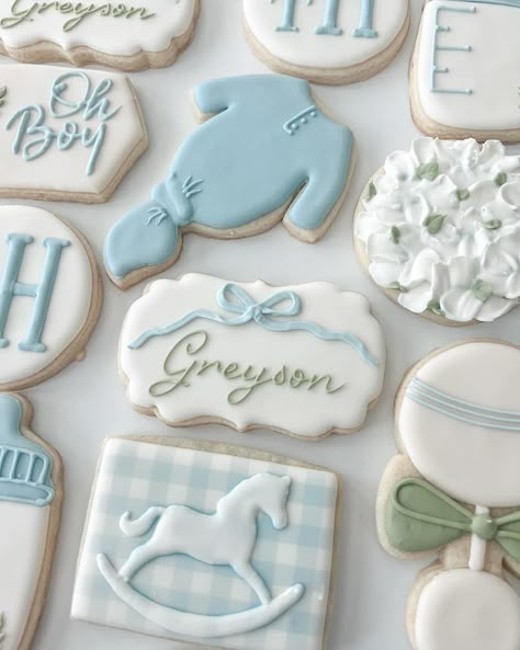 Everything about this checks my favorites list 🤩 the shade of blue, the monogram, the gingham, the ribbon, the hydrangea just yessss!! 🤍 #babyshowercookies #babycookies #babyboycookies #boybabyshowercookie #babyboycookies #babyboy #babyshower #customcookies #cookiesofinstagram #cookies #royalicing #royalicingcookies #dfwcookies #dfwcustomcookies #dfwparties #argyletx #colleyvilletx #southlaketx #flowermoundtx Baby Royal Icing Cookies, Vintage Blue Baby Shower Ideas, Green And Blue Baby Shower Ideas, Blue Bow Baby Shower Theme, Blue Gingham Baby Shower Ideas, Gingham Baby Shower Ideas, Blue Baby Shower Cookies, Baby Shower Cookies Boy, Baby Boy Shower Food