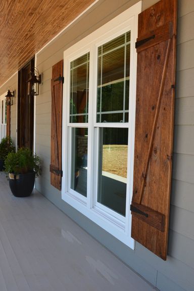 Front porch with custom ceiling, cedar posts, stone columns and wood shutters. Farmhouse Exterior Design, Farmhouse Front Porches, Shutters Exterior, Casa Exterior, Modern Farmhouse Exterior, Wood Shutters, Farmhouse Exterior, Style At Home, Exterior House Colors