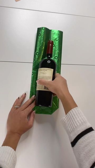 How To Wrap Water Bottles Gift, How To Wrap A Tumbler, How To Wrap A Bottle Of Wine With Paper, How To Wrap A Liquor Bottle, Wine Bottle Wrapping Ideas Christmas, How To Wrap Cups Gift Ideas, Wrapping Bottles Gift Ideas, How To Gift Wrap A Bottle, How To Wrap A Bottle Of Wine