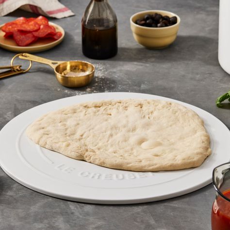 Host a family pizza night at home with this easy pizza dough recipe from Dan Pelosi. The perfect amount for one 12-inch pizza, the recipe is easily doubled or tripled as the guest list increases. A quick 30-minute rise time means you can have a finished pizza on the table in under an hour. But because this dough is so resilient, it can also be made up to 3 days in advance when stored in the fridge, ready to use. Pizza Dough Recipe Rapid Rise Yeast, Pizza Hut Inspired Homemade Dough, Stanley Tucci Pizza Dough, The Practical Kitchen Pizza Dough, 70% Hydration Pizza Dough Recipe, Oven Bread, Pizza Dough Recipe Easy, Pizza At Home, Easy Pizza Dough