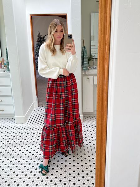 This red plaid maxi skirt from Red Dress is the perfect festive piece to add to your holiday looks. I paired it with these green heels from Amazon that I've posted a lot about and a basic white sweater. Let me know what you think! | festive, holidays, looks, party, outfits, style, sweater, maxi skirt, plaid, heels Red Plaid Dress Outfit Winter, Red Maxi Skirt Outfit Winter, Long Red Plaid Skirt Outfit, Plaid Skirt Outfit Christmas, Cold Weather Christmas Outfits, Holiday Church Outfit, Christmas Work Outfits Women, Red Heel Outfits, Red Skirt Christmas Outfit