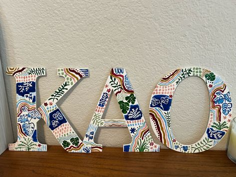 Big little crafts, hand painted wooden sorority letters Painting Sorority Letters, Sorority Craft Ideas, Painted Letters Sorority, Painted Sorority Letters Wooden, Sorority Letters Painted Wooden, Sorority Wooden Letters, Wooden Sorority Letters, Painted Sorority Letters, Diy Sorority Crafts