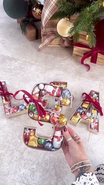 Hobbycraft on Instagram: "Who else is obsessed with @mrshinchhome’s easy handmade Christmas gift idea? 😍⁠ ⁠ Line our wooden fillable letters with red felt, fill with treats of your choice, cover in cling film and seal with a bow. A super simple Christmas gift for a loved one this year! 🎁⁠ ⁠ Shop now by heading to the link in our bio. ⁠ ⁠ #Hobbycraft #ChristmasMadeForYou #ChristmasCraft #ChristmasCrafting #DIYChristmasGift #ChristmasGifts #ChristmasGiftIdeas #ChristmasGifting #Christmas2022 #Mr Fillable Letters Ideas, Fillable Letters, Easy Handmade, Easy Christmas Gifts, Christmas Favors, Cling Film, Red Felt, Handmade Christmas Gifts, Christmas Gift Idea