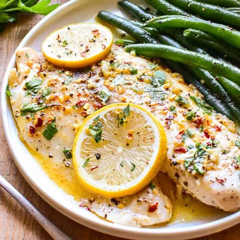 Garlic Butter Baked Tilapia - Lemon Tree Dwelling Tilapia Recipes Healthy, Parmesan Roasted Green Beans, Baked Tilapia Recipes, Baked Tilapia, Tilapia Recipes, Garlic Butter Sauce, Baked Garlic, Fish Recipes Healthy, Garlic Butter