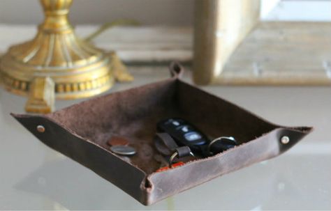 Over on eHow: DIY Leather Valet Tray | 17 Apart Diy Leather Valet Tray, Leather Embossing, Leather Valet Tray, Catchall Tray, Valet Tray, Leather Organization, Tray Diy, Eagle Scout, Entryway Console