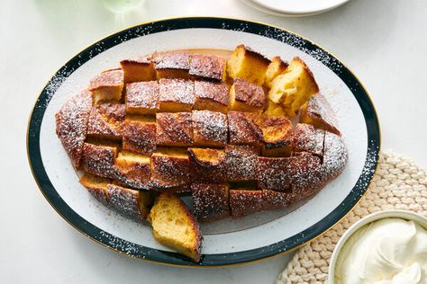 Like a good pitcher of eggnog, this French toast is rich, sweet, boozy and covered in nutmeg Slicing the bread but keeping the base connected not only makes this an attractive breakfast centerpiece, it also feeds family and friends with little effort since all the servings bake simultaneously Allowing it to soak in the refrigerator overnight deepens the dish’s flavors Cool Crowns, Overnight French Toast Recipe, Ny Times Recipes, Spoon Cake, Treat Making, Nyt Recipes, Eggnog French Toast, Become A Morning Person, Overnight Breakfast Casserole