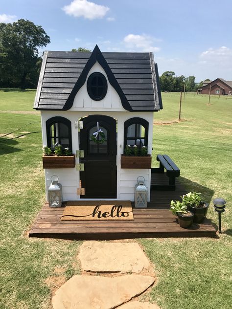 Playhouse On Pavers, Outdoor Wooden Play House Makeover, Black And White Playhouse, Outdoor Playhouse Flooring Ideas, Playhouse Outdoor Decor, Playhouse Flooring Ideas, Playhouse Decor Interior, Wood Playhouse Makeover, Black Playhouse