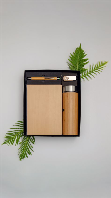 This gift box contains items made with bamboo. The gift hamper includes
An insulated bamboo bottle
A bamboo cover recycled paper notepad
Bamboo pen
8GB Pen drive Box Photoshoot, Bamboo Bottle, Client Gift Box, Corporate Branded Gifts, Pen Gift Box, Corporate Giveaways, Bamboo Pen, Desk Gifts, Hamper Boxes