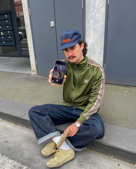 man in japanese fashion outfit sitting on curb asking for his photo to be taken Clarks Wallabees Men Outfit, Wallabees Outfit Men, Track Jacket Outfit, Clarks Outfit, Clarks Wallabees Outfit, Clarks Wallabees Men, Wallabees Outfit, Dapper Fashion, Track Pants Outfit