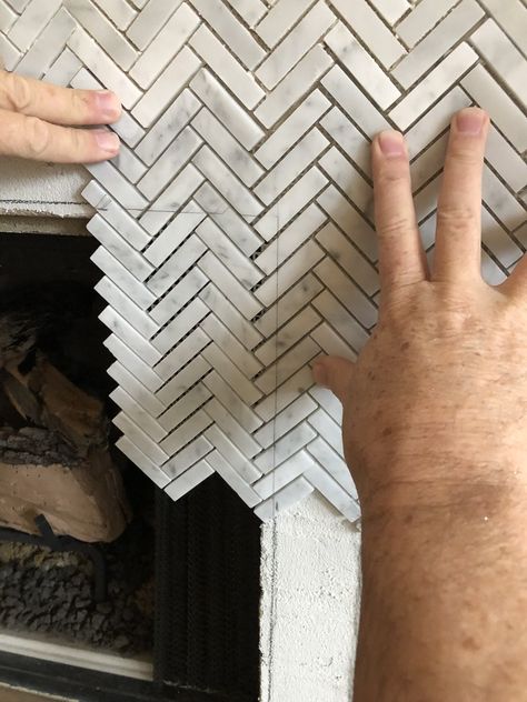 How to Add Herringbone Marble Tile to a Fireplace - Southern Hospitality Herringbone Tile Fireplace, Tile Around Fireplace, Herringbone Fireplace, Hearth Tiles, Fireplace Feature Wall, Fireplace Redo, Fireplace Update, Fireplace Tile Surround, Brick Fireplace Makeover