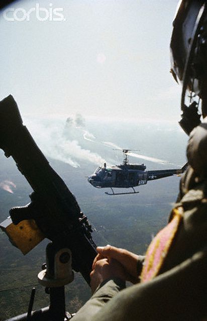 1965 - A view over the shouder of a US helicopter gunner during a Delta dawn assault - Image by © Tim Page/CORBIS | Flickr - Photo Sharing! Delta Dawn, Dead Costume, Halo Collection, Vietnam History, North Vietnam, South Vietnam, Military Helicopter, Us Marines, Vietnam Veterans