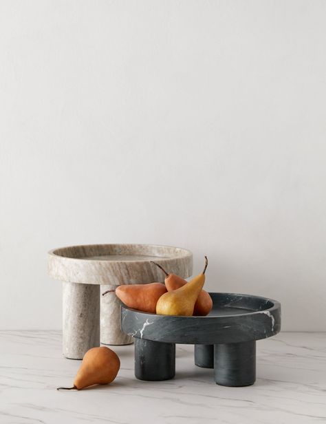 Two shallow marble bowls set on pillar feet add polish and a sculptural dimension to any counter or tablescape. We love the offset silhouettes and tonal contrast this luxe set creates when styled as a pair. Businesses Ideas, Marble Bowl, Marble Decor, Lulu And Georgia, Ceramics Ideas Pottery, Outdoor Dining Furniture, Centerpiece Bowl, Serving Food, Centerpiece Decorations