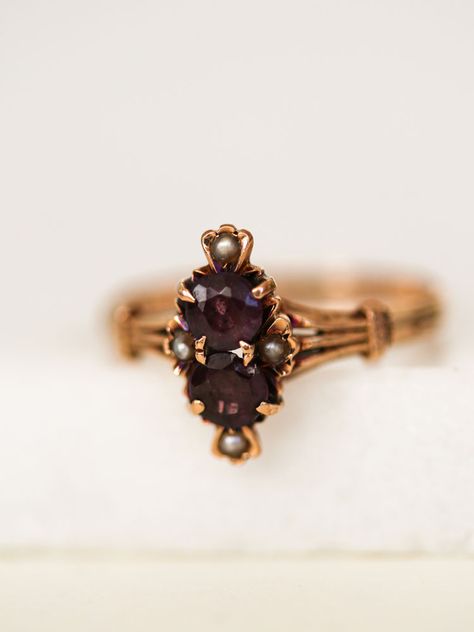 She's a rare gorgeous touch of Victorian class, two vertically stacked Amethyst stones framed by 4 Pearls, a striking cocktail ring and a rare find set in ornate 14k Victorian gold work. An exquisite piece when there is always an excuse to get dressed up.      	Ladies Size 7  	14k Yellow Gold setting  	0.5 tcw Amethysts, Pearls  	Arrives in gift box  Exclusively from Erin Pelicano Curated Vintage Collection. Each piece is intentionally chosen, pre owned, and ready to be loved and cherished again Antique Rings Aesthetic, Ornate Gold Rings, Vintage Rings Antiques, Grad Presents, Victorian Rings Vintage, Victorian Wedding Ring, Antique Jewelry Victorian, Unique Jewelry Vintage, Antique Rings Victorian