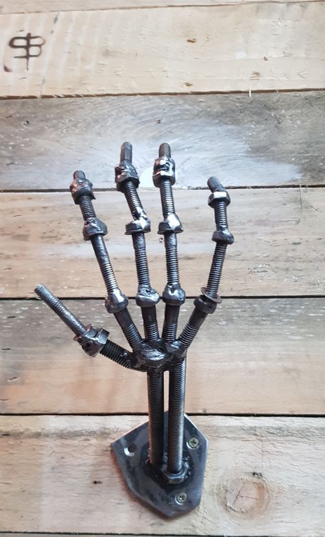 Scrap metal sculpture skeletons hand Welded Skeleton Hand, Welding Projects Sculptures & Statues, Skeletons Hand, Scrap Metal Sculpture, Junk Metal Art, Metal Skeleton, Welding Art Projects, Metal Skull, Metal Working Projects