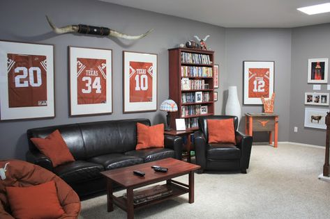 Classy Man Cave: Texas Longhorn-Themed Game Room Décor.  Framed retired Texas football jerseys, dark leather, burnt orang accents, and cherrywood stained furniture. Click or visit FabEveryday.com for all the details on how to style your own chic (not tacky) man cave! Apartment Decorating For Men, Vows To Husband, Man Cave Basement Diy, Classy Man Cave, Stained Furniture, Classy Man, Sports Man Cave, Wedding Vows To Husband, Ultimate Man Cave