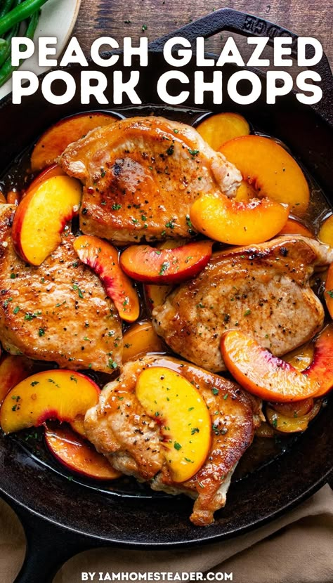 A black skillet has four pork chops, several peach slices, and peach glaze in it. It is on a wooden counter top with a brown tea towel next to it. Top Loin Pork Chops, Peach Main Dish Recipes, Pork Chops Peaches Recipes, Peach And Pork Chop Recipes, Peach Pork Chop Recipes, Pork Chop Peaches Recipe, Pork Chops With Peaches Recipe, Peach Pork Chops Crock Pot, Peaches And Pork Chops