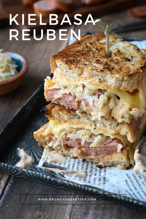 This delicious spin on the classic Reuben sandwich is made with smoky kielbasa sausage for a unique twist. With a homemade thousand island dressing, sauerkraut, and melty Swiss cheese, this is one brunch sandwich you don't want to miss. Kielbasa And Sauerkraut Sandwich, Kielbasa Sandwich Recipes, Kielbasa Sandwiches, Kielbasa Sandwich, Keilbasa And Sauerkraut, Homemade Thousand Island, Grilled Kielbasa, Classic Reuben Sandwich, Sauerkraut Sandwich